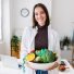 portrait-of-young-nutritionist-woman-holding-a-bow-2025-03-10-17-44-37-utc-e1752731706644-1